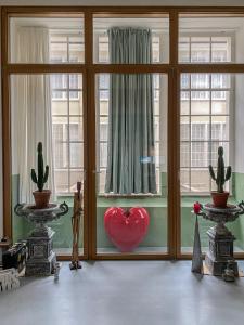 a room with a red heart in a window at Loft Designer in Neuhausen am Rheinfall