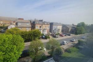 a view of a city with cars parked on a street at Bright & Lovely & apartment in Whetstone