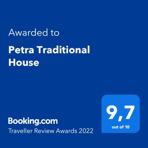 a blue screen with the text awarded to pta traditional house at Petra Traditional House in Episkopión