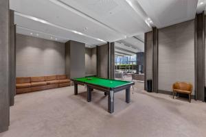 a billiard room with a green table in it at Southbank CBD Apartment with Spectacular Views in Melbourne