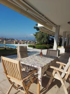 a table and two chairs on a patio at Villa Sergio in Bardolino