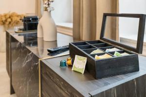 a black box on a counter with a mirror at BOUTIQUE ROOMS I Luxus Suite I Center I Boxspring in Augsburg +10 photos