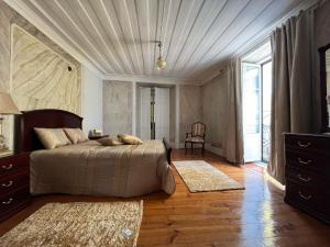 Cama ou camas em um quarto em Alojamento VINTAGE BAIXA - TOMAR
