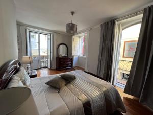 Cama ou camas em um quarto em Alojamento VINTAGE BAIXA - TOMAR