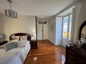 Cama ou camas em um quarto em Alojamento VINTAGE BAIXA - TOMAR