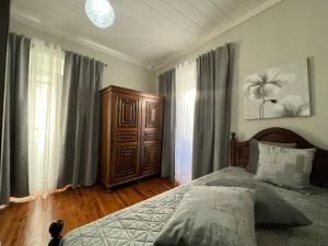 Cama ou camas em um quarto em Alojamento VINTAGE BAIXA - TOMAR