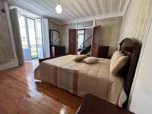 Cama ou camas em um quarto em Alojamento VINTAGE BAIXA - TOMAR