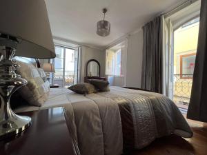 Cama ou camas em um quarto em Alojamento VINTAGE BAIXA - TOMAR