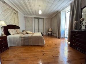 Cama ou camas em um quarto em Alojamento VINTAGE BAIXA - TOMAR