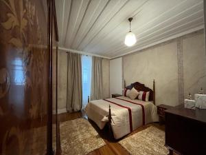 Cama ou camas em um quarto em Alojamento VINTAGE BAIXA - TOMAR