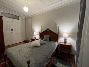 Cama ou camas em um quarto em Alojamento VINTAGE BAIXA - TOMAR