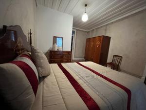 Cama ou camas em um quarto em Alojamento VINTAGE BAIXA - TOMAR