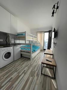 a room with two bunk beds and a washing machine at Apartment N503 Gudauri Loft in Gudauri