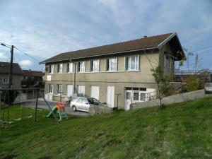a house with a car parked in front of it at la berlie du jura in Étival