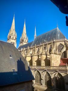 a large cathedral with two towers and a blue sky at Jacquemart in Moulins
