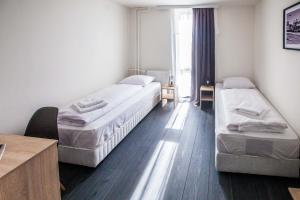 Postel nebo postele na pokoji v ubytování Hotel Rajka