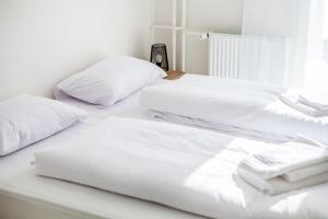 Postel nebo postele na pokoji v ubytování Hotel Rajka