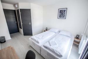Postel nebo postele na pokoji v ubytování Hotel Rajka