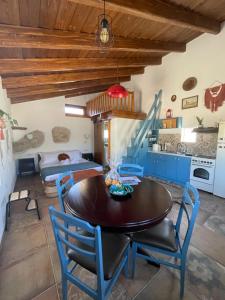a kitchen and dining room with a table and chairs at Konstantino's Place in Samos