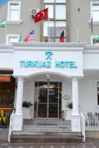 a hotel with a sign on the front of it at Turkuaz Hotel in Gebze