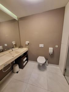 Koupelna v ubytování Adresa Suites