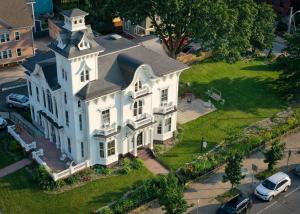 an aerial view of a large white house at The Wedding Cake House in Providence