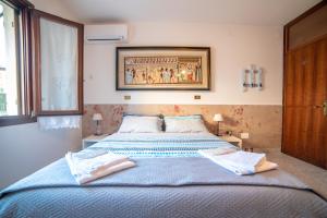 Posteľ alebo postele v izbe v ubytovaní B&B LELLA