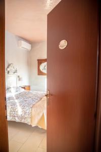 Posteľ alebo postele v izbe v ubytovaní B&B LELLA