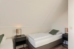 Postel nebo postele na pokoji v ubytování Villa Vermeer