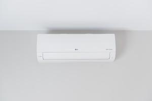 a white computer monitor on a white wall at Stegna Holiday in Archangelos