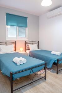 Postel nebo postele na pokoji v ubytování Stegna Holiday