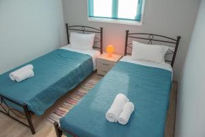 A bed or beds in a room at Stegna Holiday
