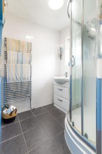 a bathroom with a shower and a sink at Host & Stay - Gorse Cottage in Mundesley