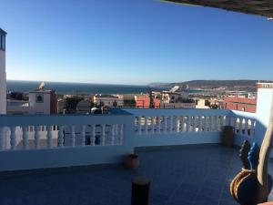 a balcony with a view of the ocean at Bayti surf hostel in Agadir