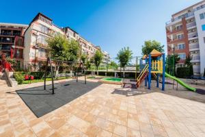 a playground with a slide at Ривиера форт бийч (Riviera Fort Beach) - Равда in Ravda