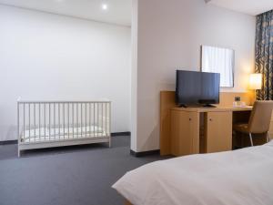 Postel nebo postele na pokoji v ubytování Hotel Coronado