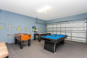 a room with two ping pong tables in it at Gorgeous 4Bd Close to Disney w/ Pool @ 4072 Solterra Resort in Davenport
