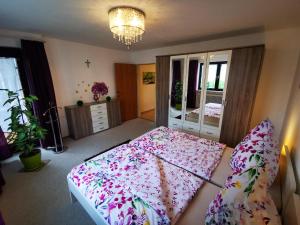 a bedroom with a large bed with an umbrella at Ferien bei Fuchs in Stein +25 photos