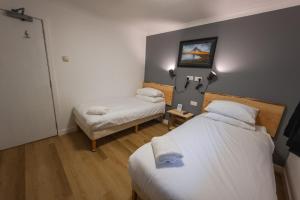 Postel nebo postele na pokoji v ubytování Roam West