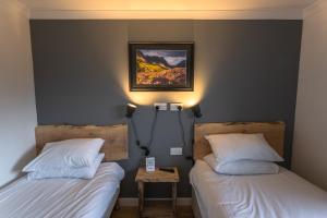 Postel nebo postele na pokoji v ubytování Roam West