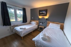 Postel nebo postele na pokoji v ubytování Roam West