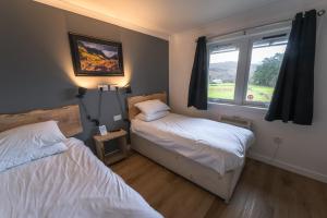 Postel nebo postele na pokoji v ubytování Roam West
