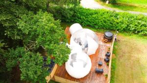 an aerial view of a boat on a wooden deck at L'étape en forêt in Saint-Sever-Calvados