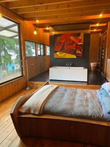 Postel nebo postele na pokoji v ubytování Casa Kleinbos en Pichilemu,Camino a Punta de Lobos