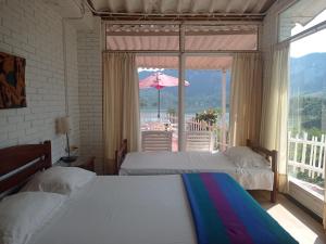Postel nebo postele na pokoji v ubytování Pradolago Sol Prado Tolima