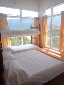Postel nebo postele na pokoji v ubytování Pradolago Sol Prado Tolima