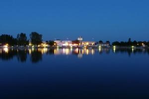 a night view of a large body of water at Studio au Port Dienville in Dienville