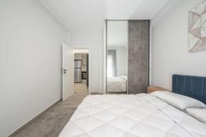 Posteľ alebo postele v izbe v ubytovaní Athens Luxurious Apartment