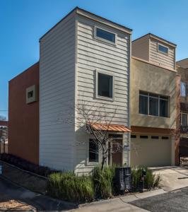 a house with a siding on the side of a building at Amazing downtown location for groups! in Little Rock