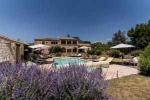 a villa with a swimming pool and a house at Mon Ventoux - Cozyhotes in Sault-de-Vaucluse